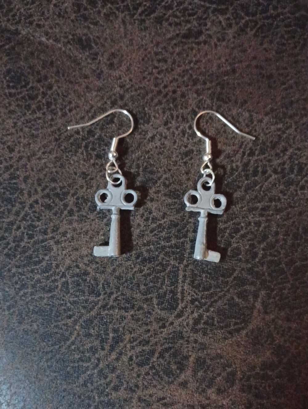 4/$60 New Key-Shaped Dangle Earrings in Gray & Silver Tone